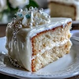 Elegant Communion sheet cake adorned with smooth pearl fondant and shimmering edible pearls, perfect for religious celebrations.