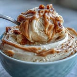 Four-ingredient peanut butter banana ice cream blended to silky perfection.  