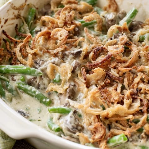 Fresh green beans and mushrooms in a rich, creamy sauce, ready for the holiday table.