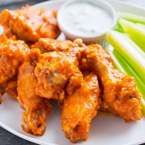 Golden fried Buffalo Wings smothered in buttery hot sauce, served crunchy with creamy blue cheese dip.